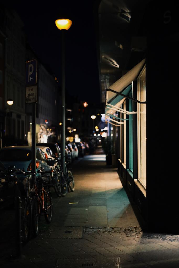 Stock image of a dark street where a store is located. 